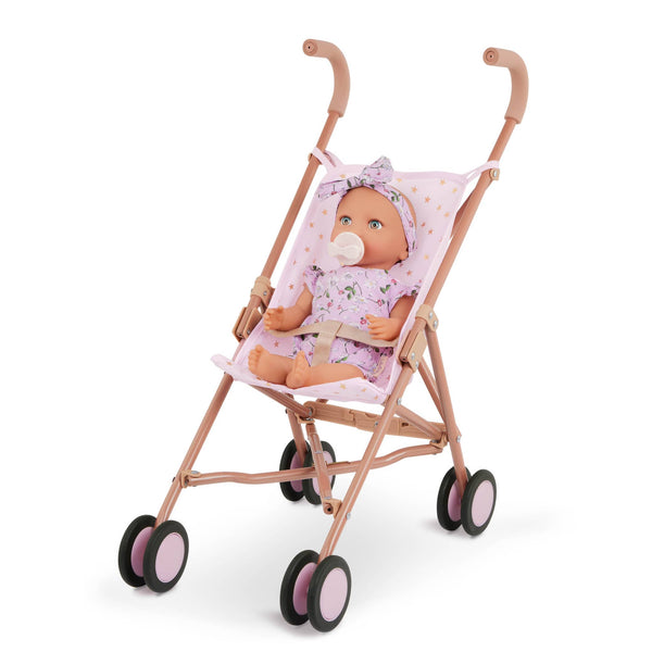 Babypuppe mit Schnuller – in einem Kleidchen mit Blümchenmuster und einem Haarband