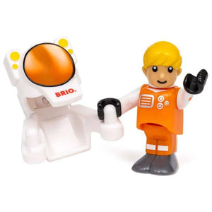 Astronautenfigur neben dem Raumanzug