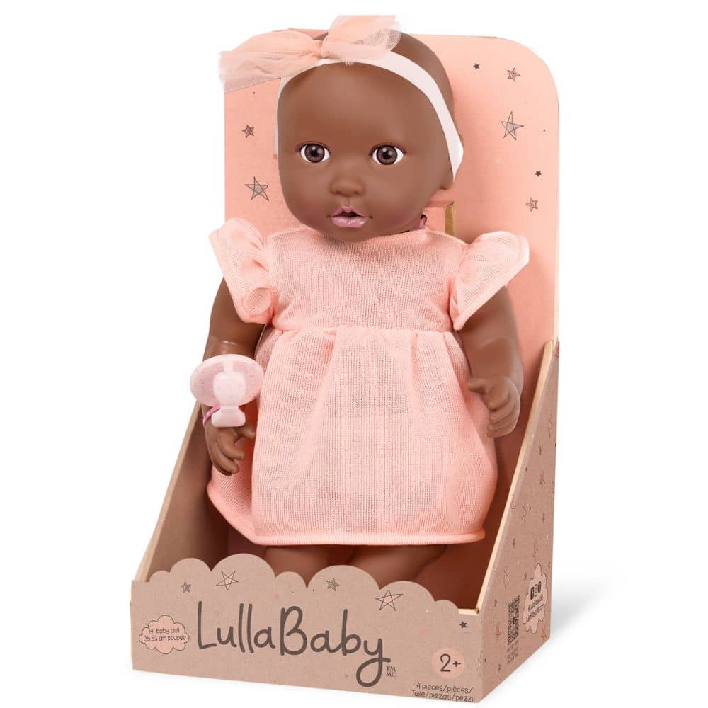 Babypuppe mit Schnuller – in einem orangefarbenen Kleid und mit einem Stirnband