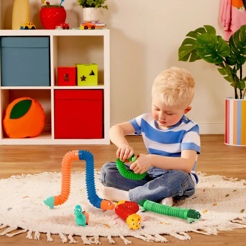 Battat Li'l Dino Buddies sensorische Röhren Dinosaurier