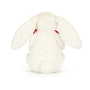 Hinteransicht des Jellycat Plüschkaninchens mit rotem Herzen in weichem weißen Material